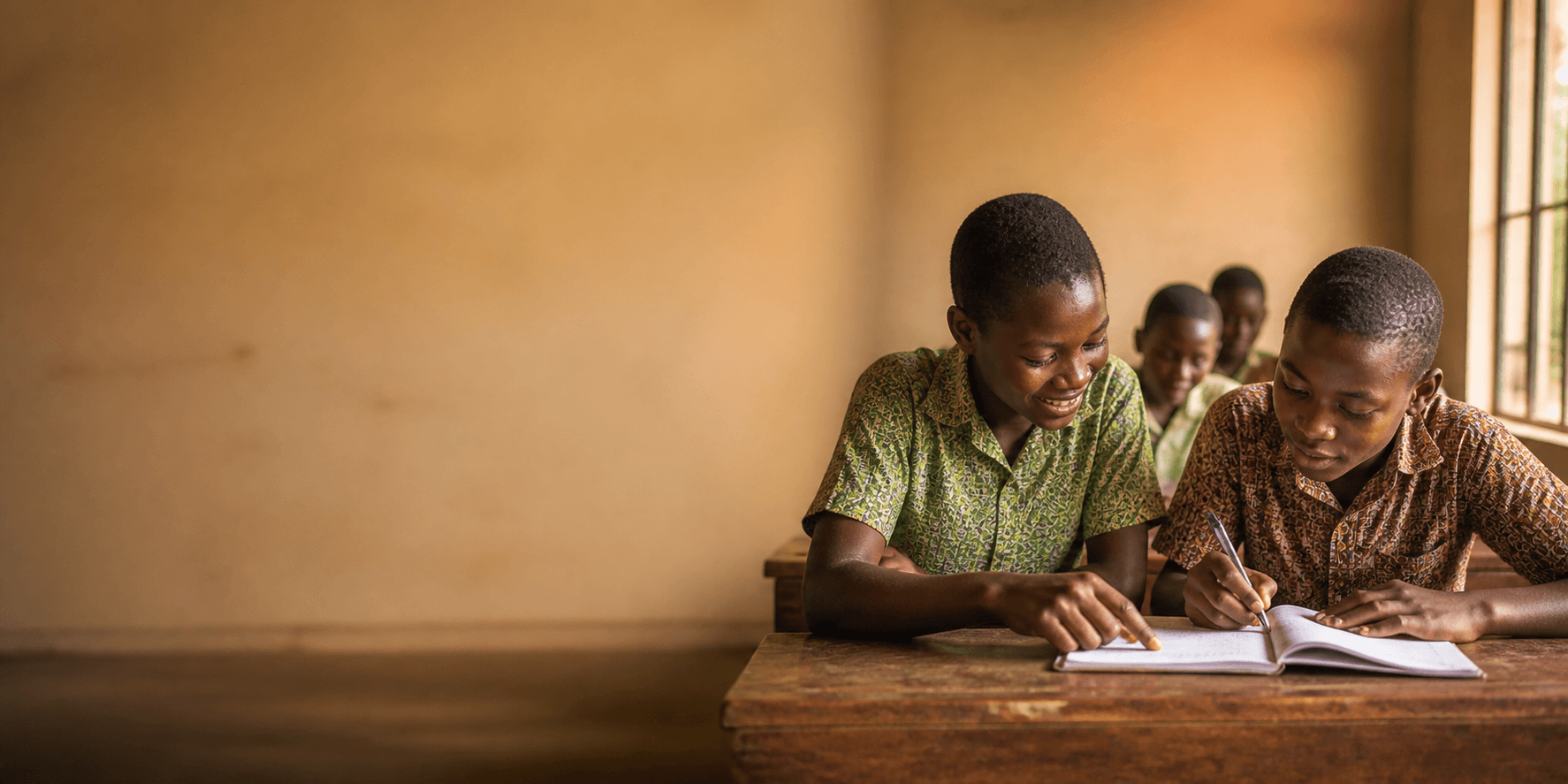 Ghanaian students learning together in a classroom